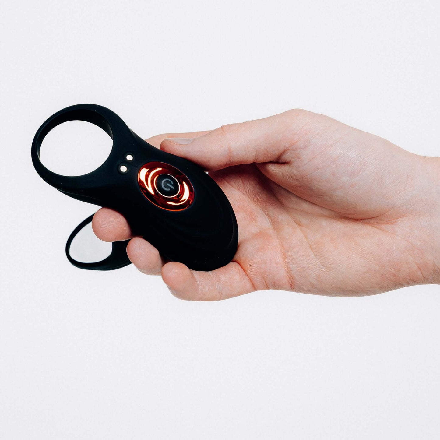 DARK CRESCENT cock ring in hand